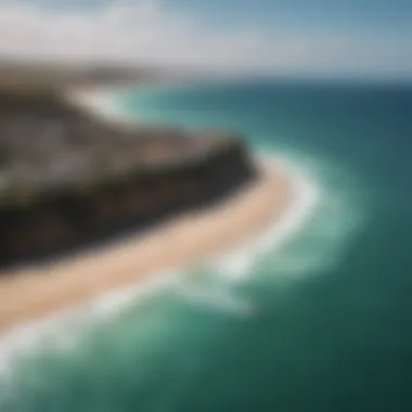 Aerial view of kitesurfers in a stunning coastal setting