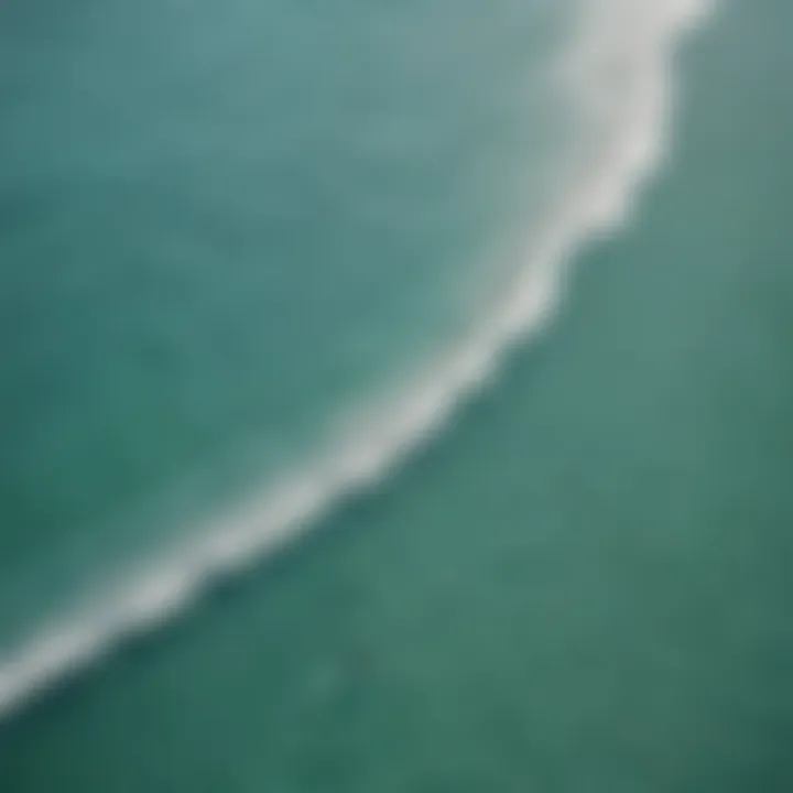 Aerial view of surfers catching waves along the coastline of Turks and Caicos