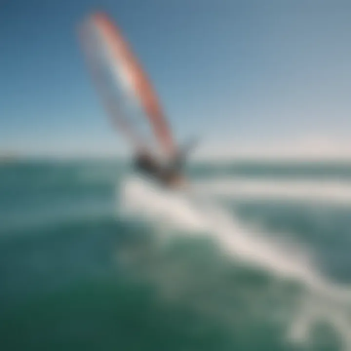 An aerial view of a kite surfer executing a perfect jump high above the water