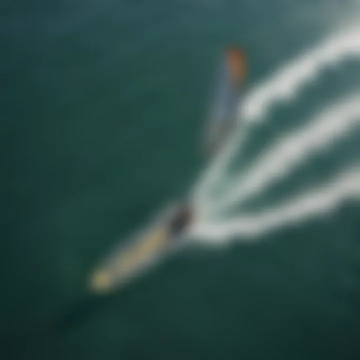 Aerial view of a kitesurfer gliding over the water with foil board and wing