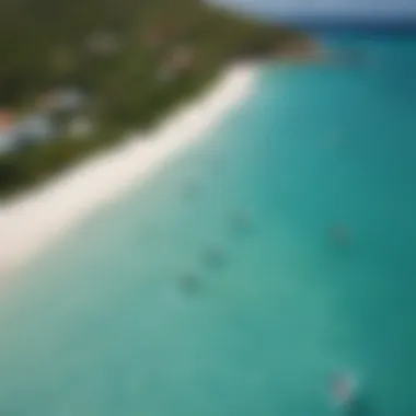 Aerial view of turquoise waters and kiteboarders in Antigua