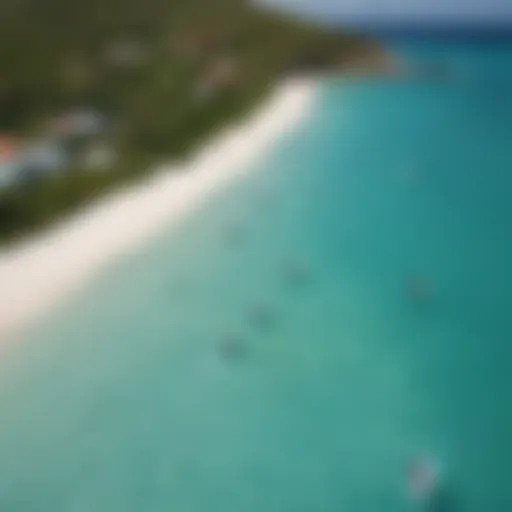 Aerial view of turquoise waters and kiteboarders in Antigua