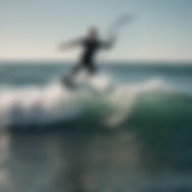 Aerial view of water foil surfer catching a wave