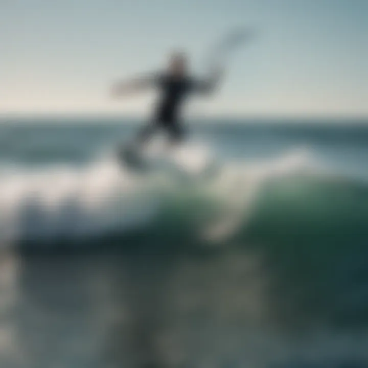 Aerial view of water foil surfer catching a wave