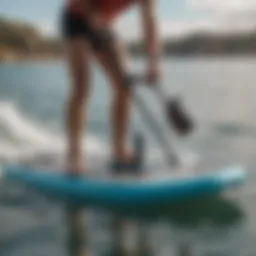 A sleek battery-operated paddle board pump in action