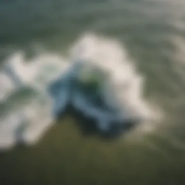 Breathtaking Aerial Shot of Kitesurfers Gliding Through Melbourne Waves