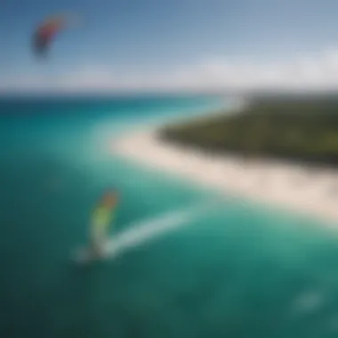 An aerial shot of a kitesurfing competition taking place on a cat island, highlighting the colorful kites against the azure ocean.