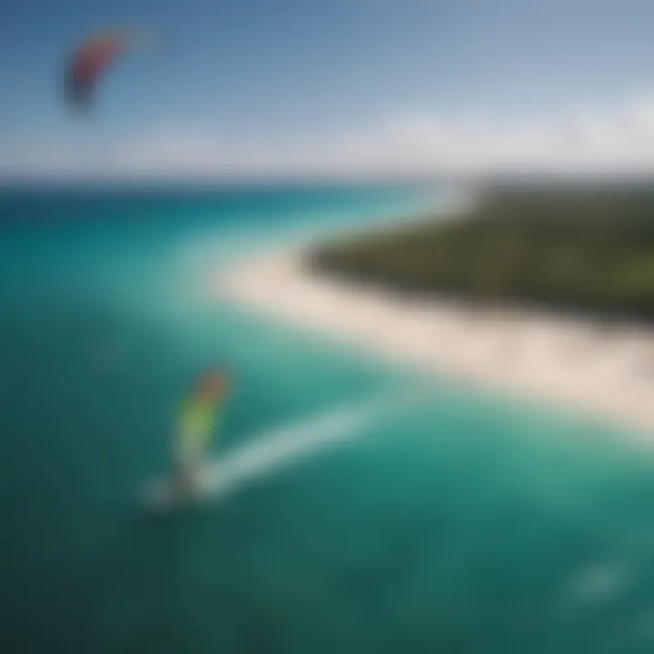 An aerial shot of a kitesurfing competition taking place on a cat island, highlighting the colorful kites against the azure ocean.