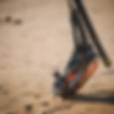 Close-up of kitesurfing gear on sandy beach