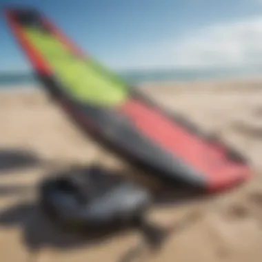 Close-up shot of colorful kitesurfing equipment on a sandy beach