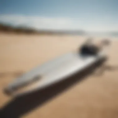 A sleek and modern kiteboard set on a sandy beach