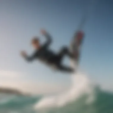 A dramatic shot of a kitesurfer in action wearing a front zip wetsuit against the ocean backdrop.