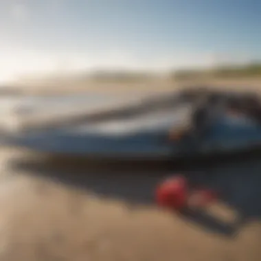 A close-up view of kitesurfing gear laid out on the beach, ready for action.