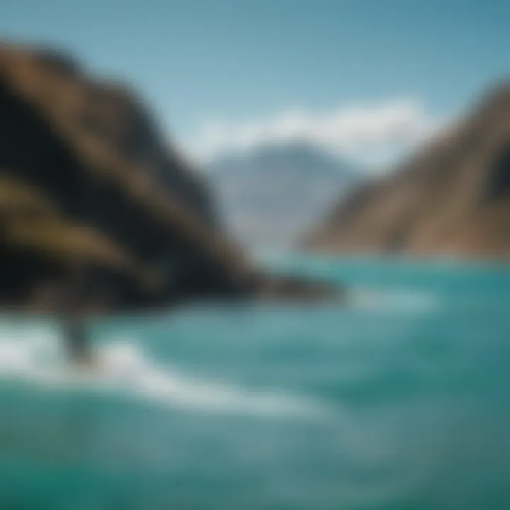 Scenic view of kitesurfers gliding across turquoise waters with mountains in background