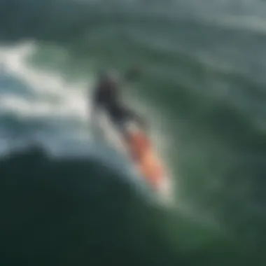 Aerial view of kite surfer riding the waves