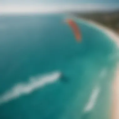 Aerial view of kitesurfing kite on turquoise waters