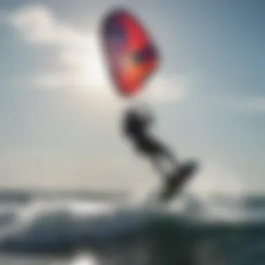 Silhouette of a kitesurfer riding the waves with a Cabrinha kite