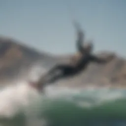 Aerial view of a kiteboarder riding the waves