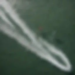 Aerial view of kitesurfers navigating the waves at Cocoa Beach