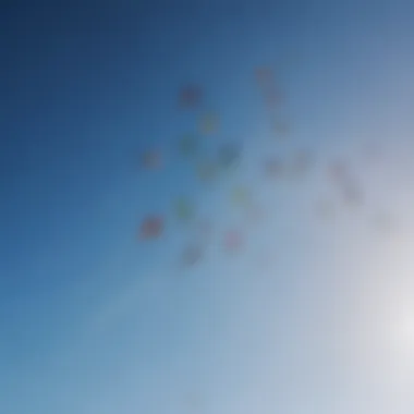 Colorful kites soaring in the clear blue sky