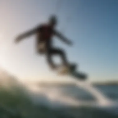 A kiteboarder performing a jump over the water, illustrating advanced kiteboarding techniques.