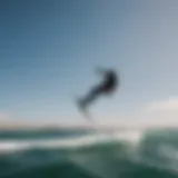 A kiteboarder gracefully maneuvering above the water on a hydrofoil.