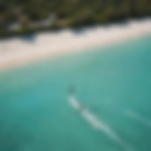 Aerial view of kite surfers in turquoise waters