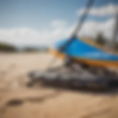 Close-up of kite surfing equipment on sandy beach