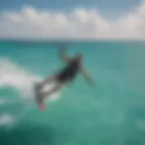 Aerial View of Kiteboarding in the Dominican Republic Kiteboarder soaring through the azure sky in the Dominican Republic