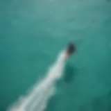 Aerial view of kiteboarders in action on turquoise waters