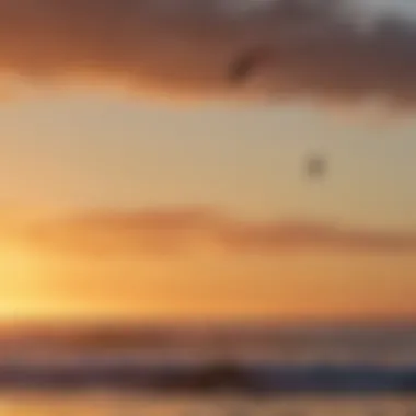 Kiteboarder in action against a stunning sunset over the Pacific Ocean