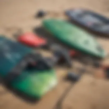 A close-up of kitesurfing gear laid out on the beach, highlighting the equipment's details.