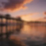 A panoramic view of Lake Worth Pier at sunset, showcasing vibrant colors in the sky and water.