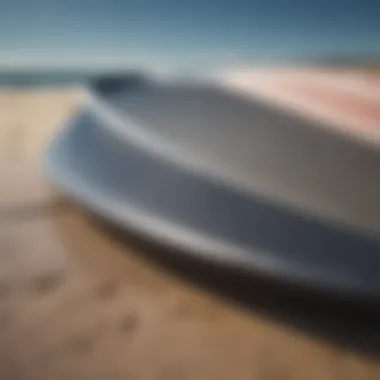 A close-up view of a foil surfboard showcasing its sleek design and hydrodynamic shape.