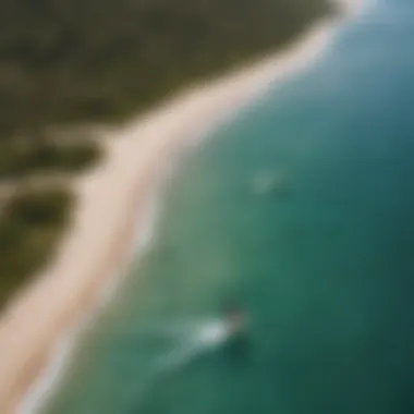 A scenic overview of a popular kitesurfing location, with clear waters and ideal wind conditions.