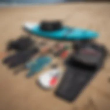 Essential kiteboarding equipment laid out on the beach