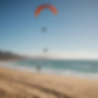 A scenic view of a popular kitesurfing location with enthusiasts enjoying the sport