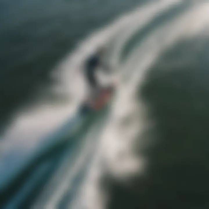 An aerial perspective of a rider transitioning from kitesurfing to hydrofoil boarding