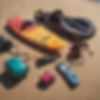 Vibrant kiteboarding gear laid out on a sandy beach