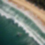 Aerial view of kitesurfers riding the waves