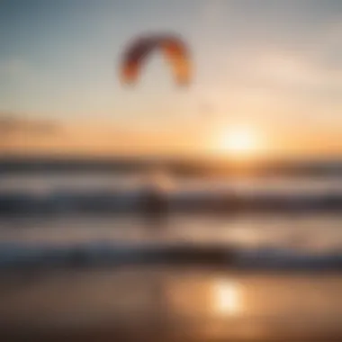 Spectacular sunset over the ocean with kitesurfers in the distance