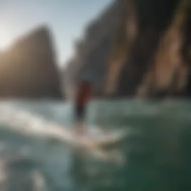 Stand-up paddleboarder navigating through rocky coastline