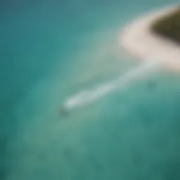 Aerial view of kiteboarders on turquoise waters