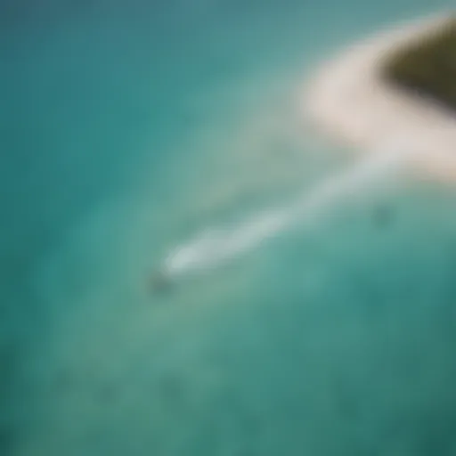 Aerial view of kiteboarders on turquoise waters