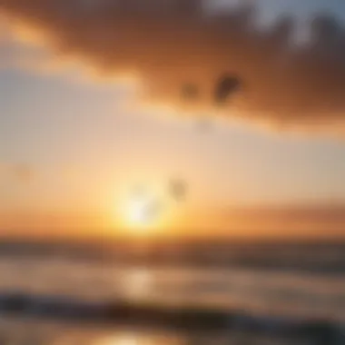 Silhouettes of kiteboarders jumping in front of a setting sun