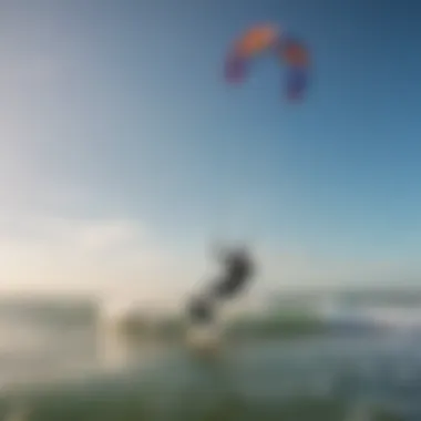 Kitesurfers navigating the vibrant waters of Tigertail Beach with colorful kites against a clear sky.