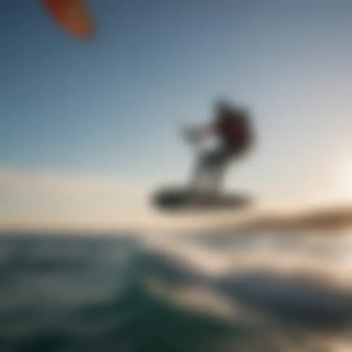 Foil boarder catching air behind a boat