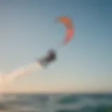 Graceful kitesurfer catching the wind in a breathtaking aerial maneuver