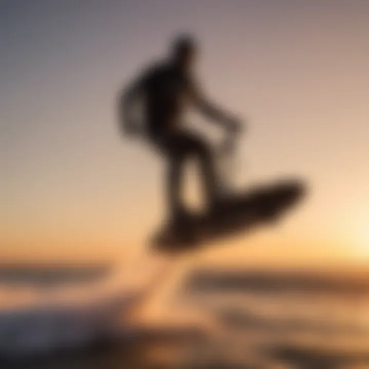 Silhouette of rider against setting sun while hover foil boarding