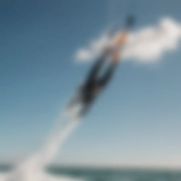 Aerial shot of a kitesurfer showcasing mastery in inverted back tricks under a clear sky